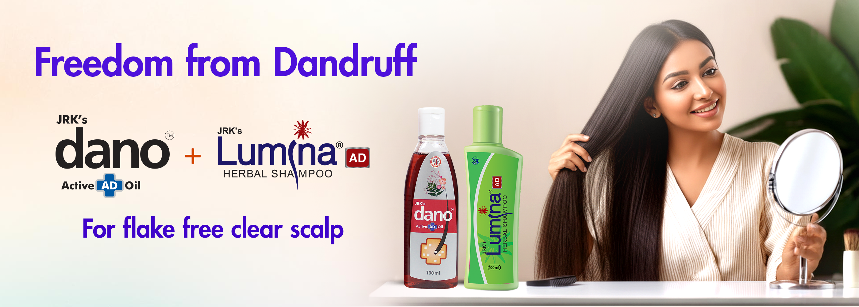 A promotional banner for hair care featuring a woman with long dark hair on the right, two bottles of hair products on the table in the center, and text on the left reading 'Freedom from Dandruff' with JRK's dano and JRK's Luminada herbal shampoo branding.