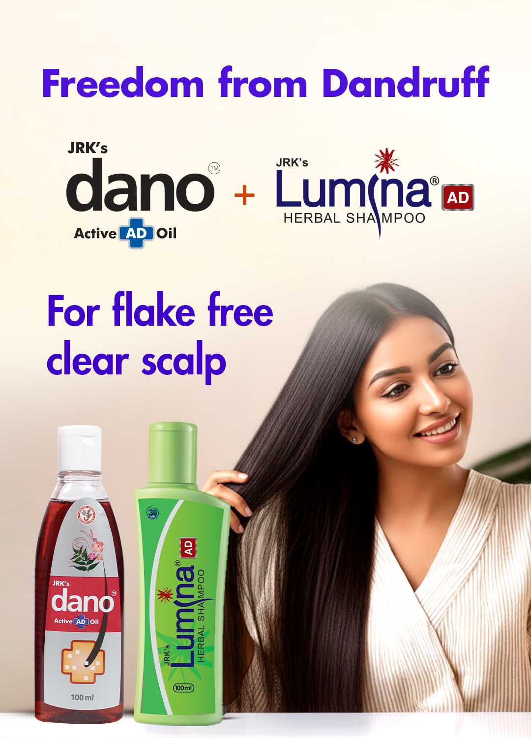 Promotional ad for JRK's dano Active AD Oil and JRK's Lum(na) AD Herbal Shampoo. A smiling woman with long, dark hair is shown next to two bottles of the products on a light beige background with purple text reading 'Freedom from Dandruff' and 'For flake free clear scalp'.